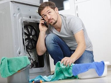 Washing machine leaking from bottom - service in Toronto and the GTA